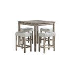 Dining set with a table and four stools in a room with large windows.