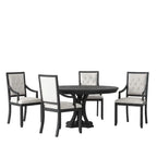 Dining room setup with a black round table and four chairs in a modern interior setting.