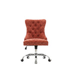 Red office chair with tufted backrest in a home office setting