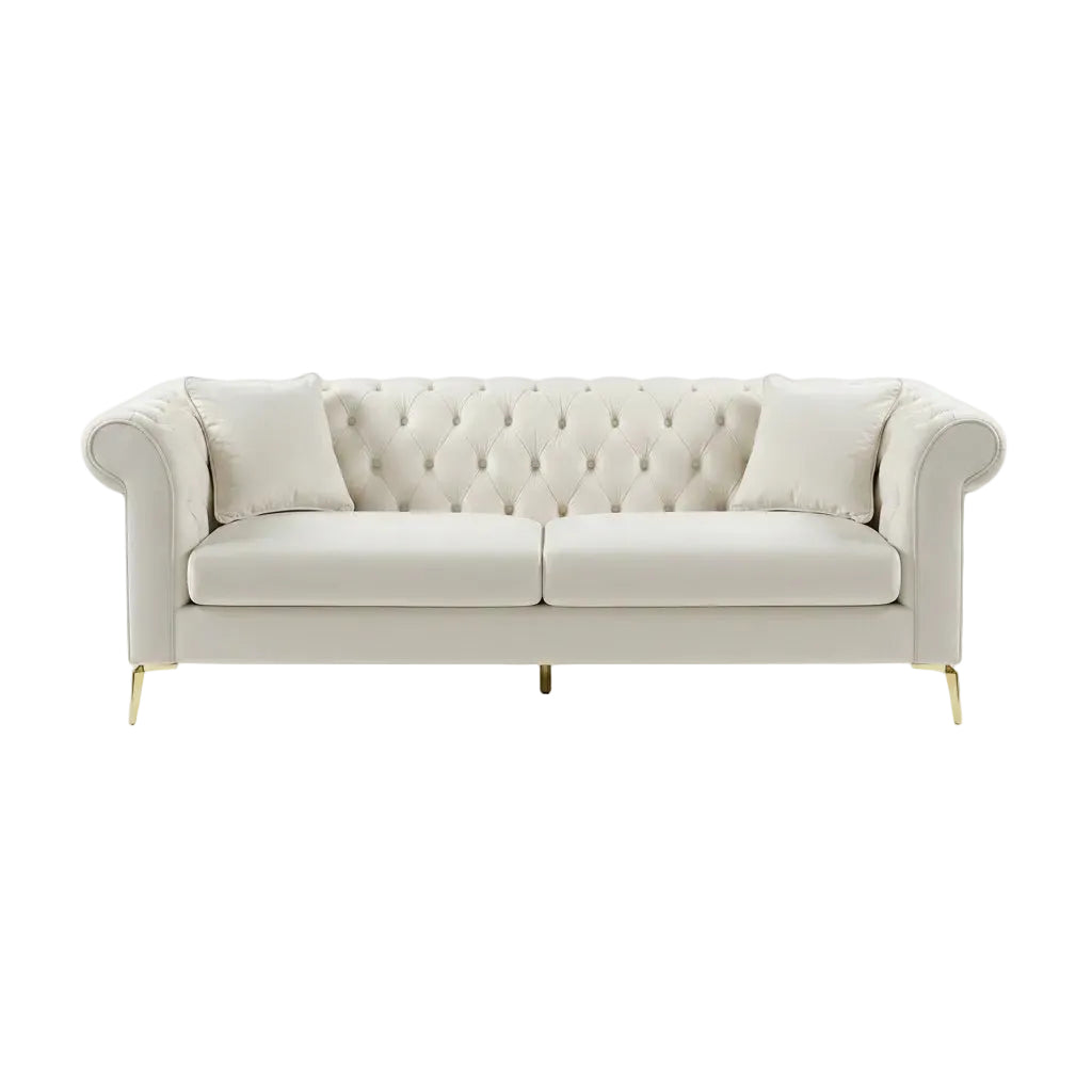 White tufted sectional sofa in a room with a rug and window.