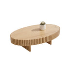 Wooden coffee table with a decorative plant on a textured surface