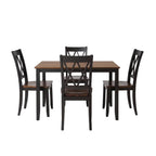 Dining room set with a table and four chairs in a well-lit room.
