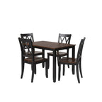Dining room with a dark wood table and chairs on a gray rug.
