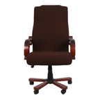 Brown office chair in a modern living room setting with yellow walls and glass coffee table.