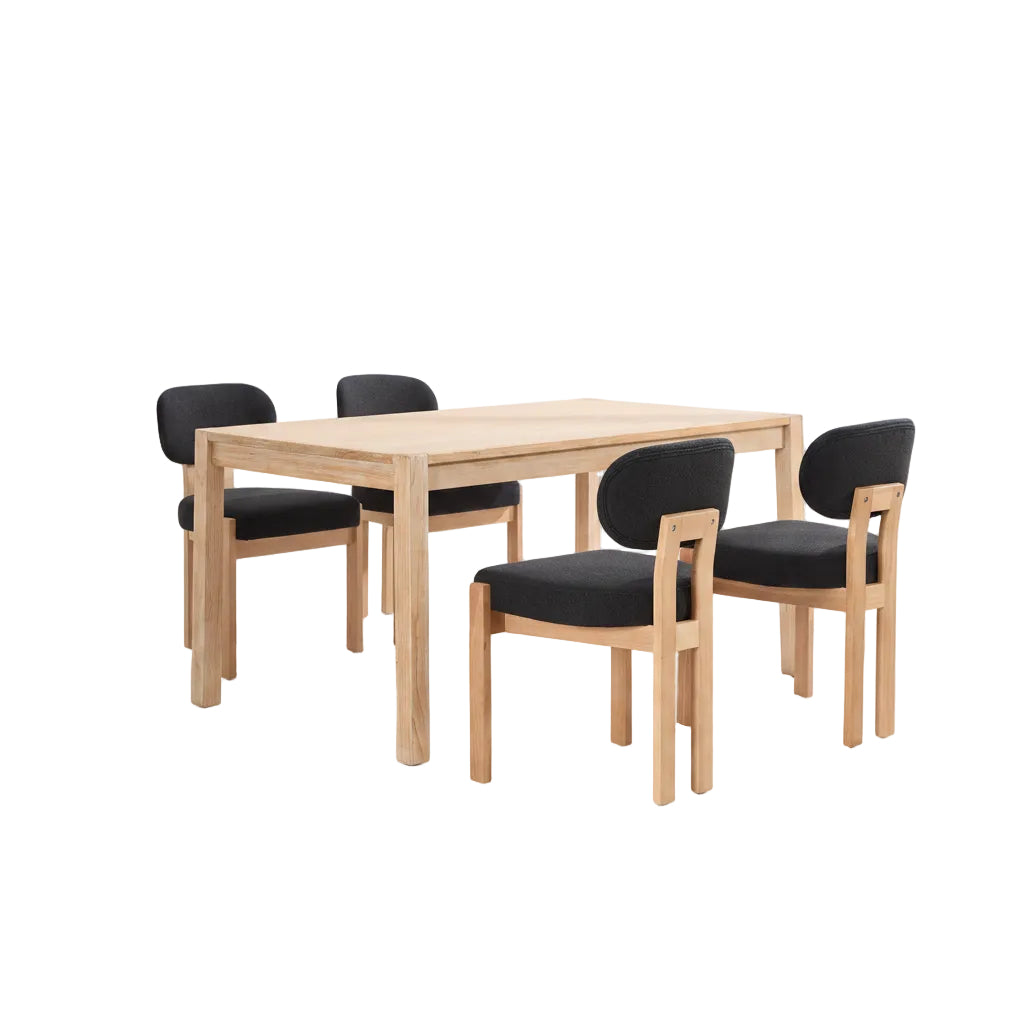 Dining room with wooden table and black chairs in a well-lit room.