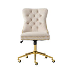 Beige office chair with gold legs in a home office setting