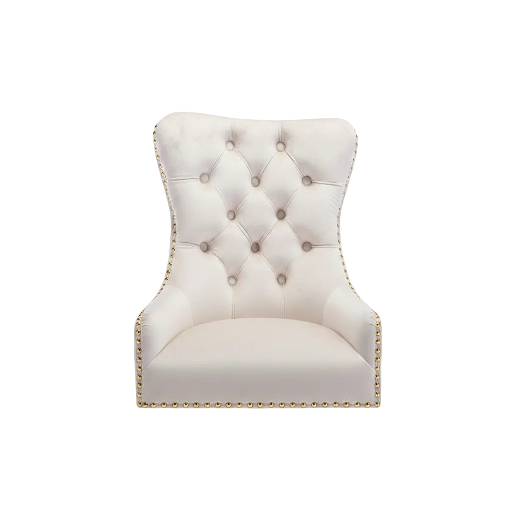 Beige tufted headboard with gold nailhead trim on a white background