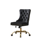 Black office chair with gold accents in a home office setting